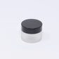 Clear frosted glass jar with black cap