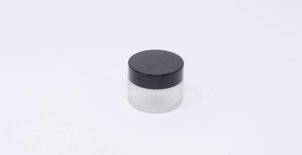 Clear frosted glass jar with black cap